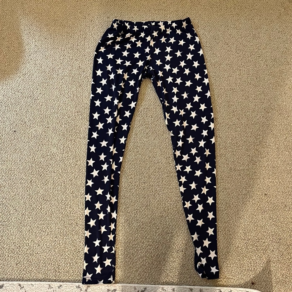White stars on navy leggings. Medium